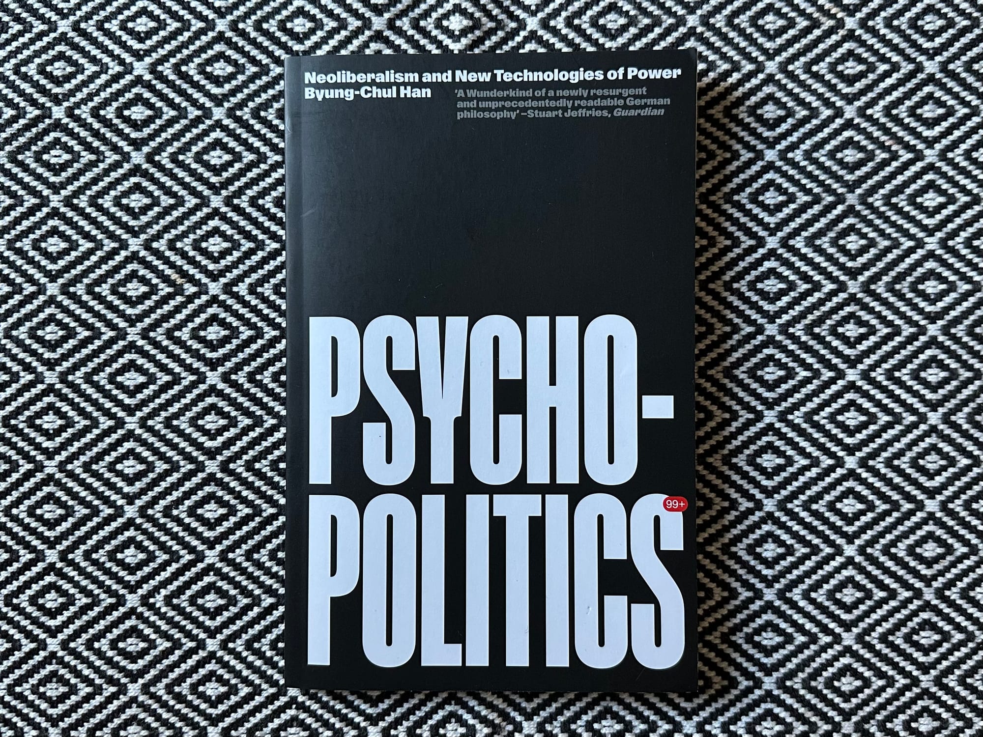 Psycho-Politics by Byung-Chul Han, a slim book with a black cover and giant white letters.