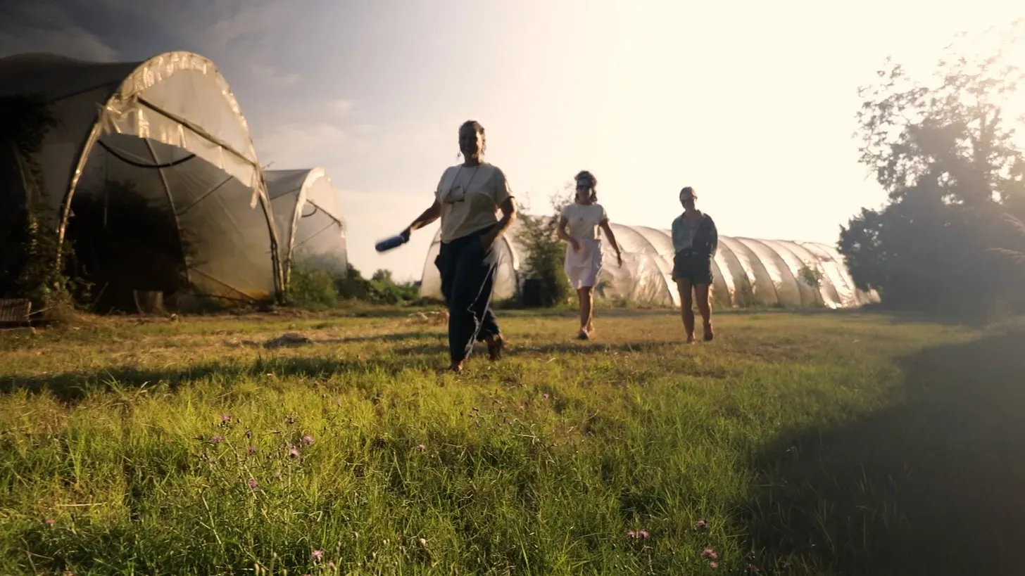 Three people walking through the farm at Residenza Lago Scuro, soon to be my temporary home in September!