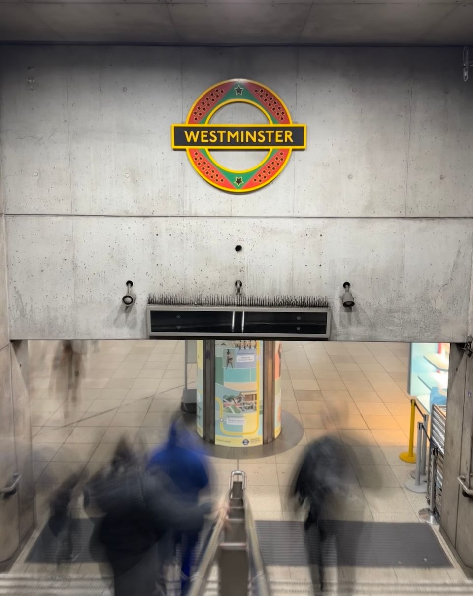 Long exposure photo of a Pan African London Underground roundel, a permanent artwork by the Ghanaian British artist Larry Achiampong.