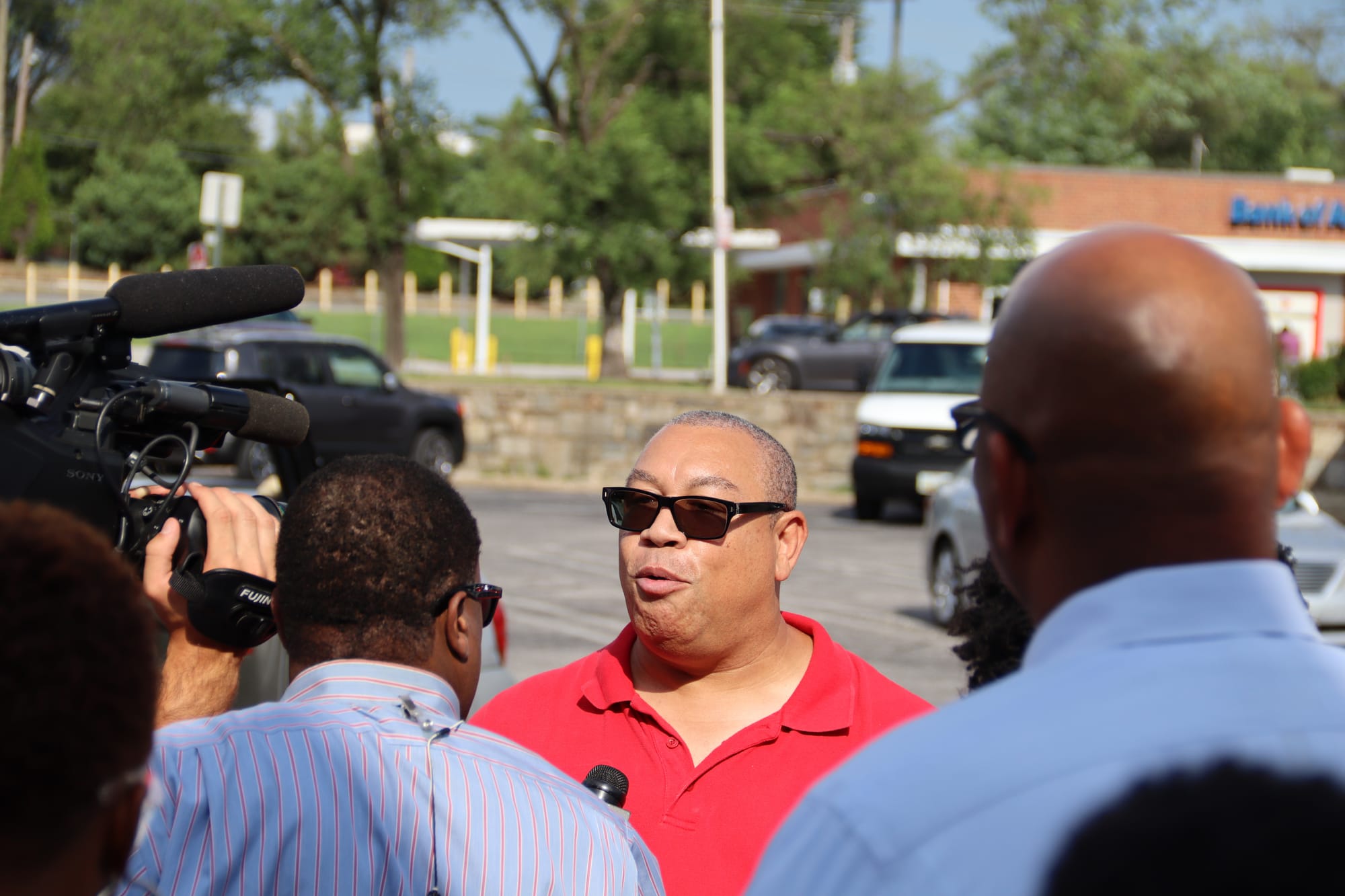 Then-Baltimore City Councilman Bill Henry speaks with media at a peace march at Alameda Shopping Center, Baltimore.  2019