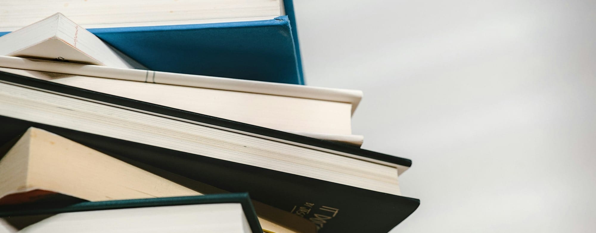 a stack of books sitting on top of each other