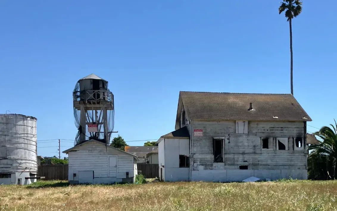 Historic Mira Flores building damaged by fire as volunteers participate in cleanup