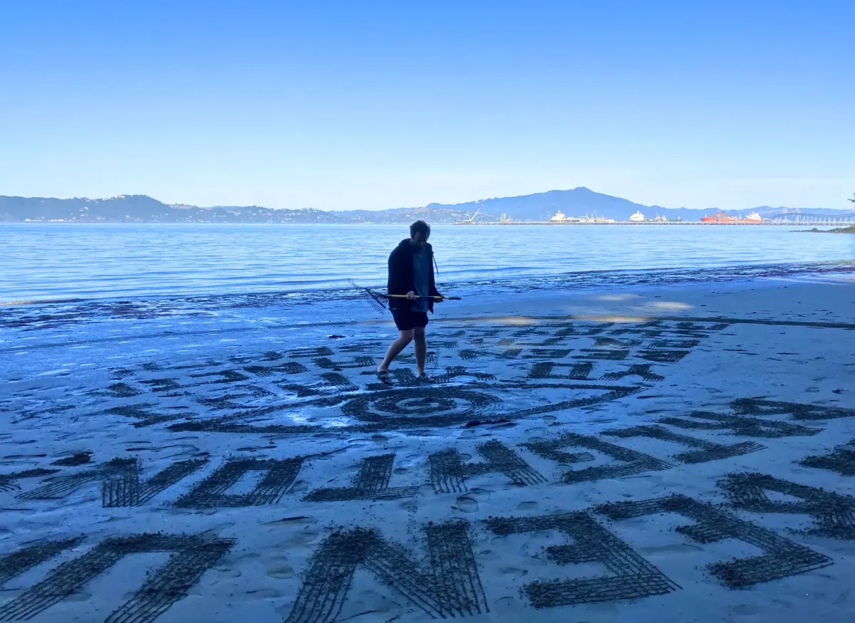 A rake, low tide, and a guy from Santa Cruz redrawing Keller Beach