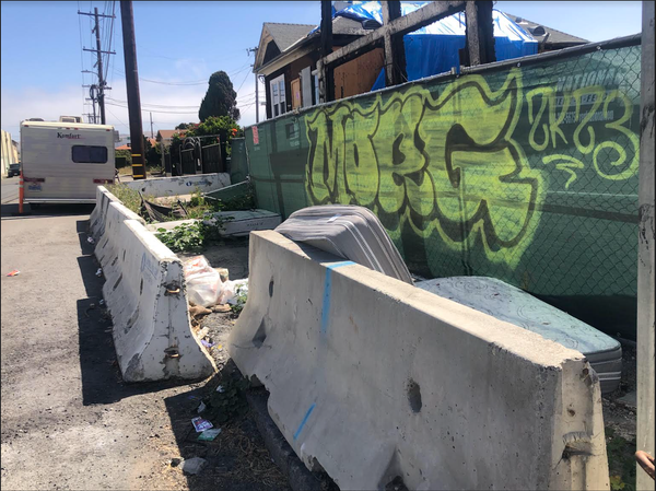 Pullman neighborhood's historic International Hotel now hosts old mattresses, garbage