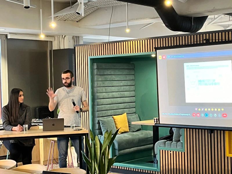 Team presenting a brand system workshop for a digital product, aligning design decisions, messaging, and visual identity across teams.