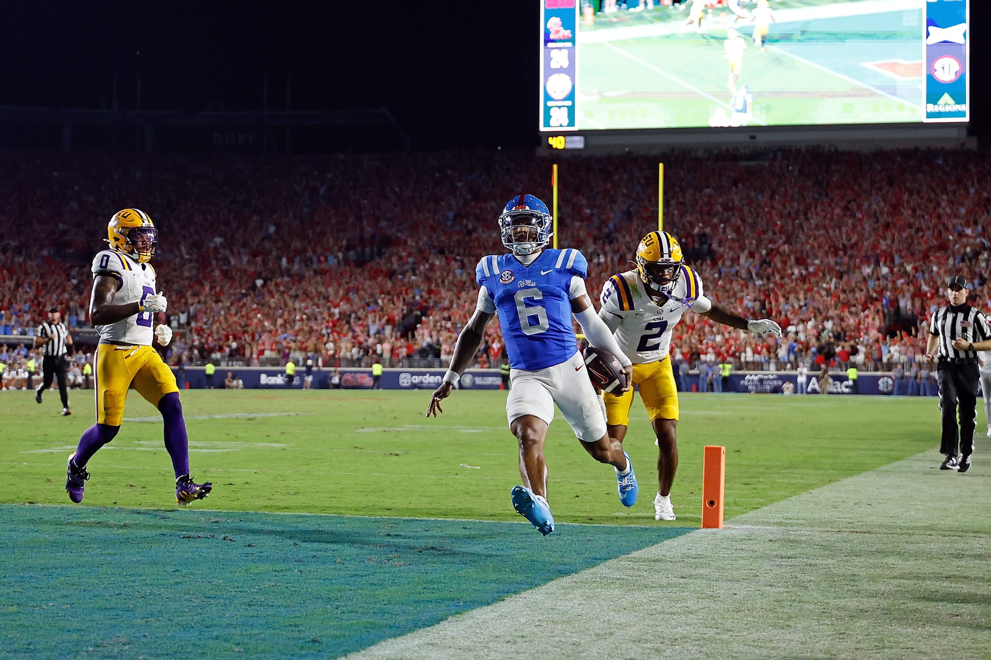 OXFORD, MISSISSIPPI - SEPTEMBER 19: Trinidad Chambliss #6 of the Mississippi Rebels scores a touchdown against Ty Benefield #2 of the Louisiana State Tigers during the second half at Vaught-Hemingway Stadium on September 19, 2026 in Oxford, Mississippi. (Photo by Justin Ford/Getty Images)