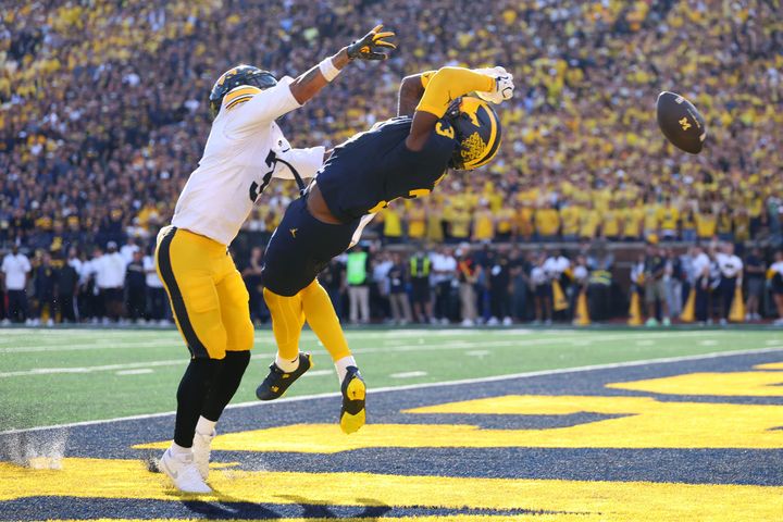 ANN ARBOR, MICHIGAN - SEPTEMBER 26: Andrew Marsh #3 of the Michigan Wolverines can't pull in a first half touchdown catch against Jaylen Watson #3 of the Iowa Hawkeyes at Michigan Stadium on 
