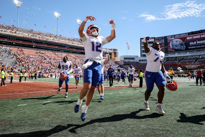 AUSTIN, TEXAS - OCTOBER 17: Aaron Philo #12 of the Florida Gators and Daniel Pierre Louis #73 celebrate after defeating the Texas Longhorns at Darrell K Royal-Texas Memorial Stadium on Octobe