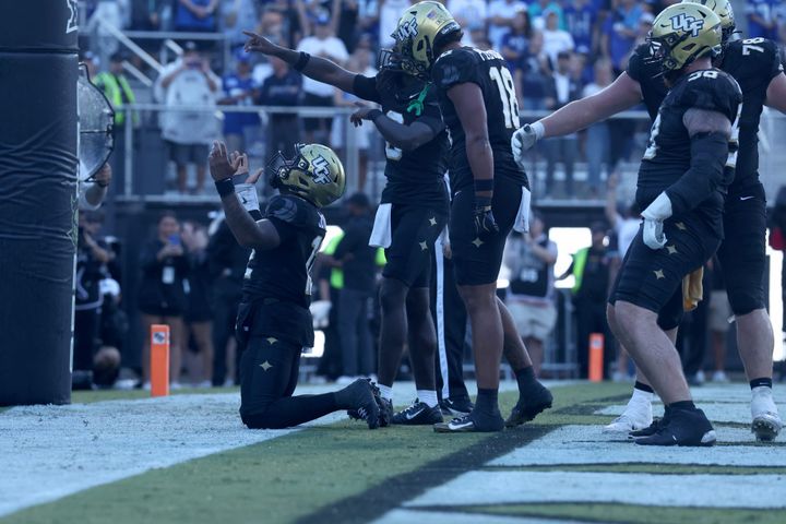 ORLANDO, FLORIDA - OCTOBER 24: Keyone Jenkins #12 of the UCF Knights reacts after a touchdown in the second half of the game between the UCF Knights and BYU Cougars at Acrisure Bounce House o
