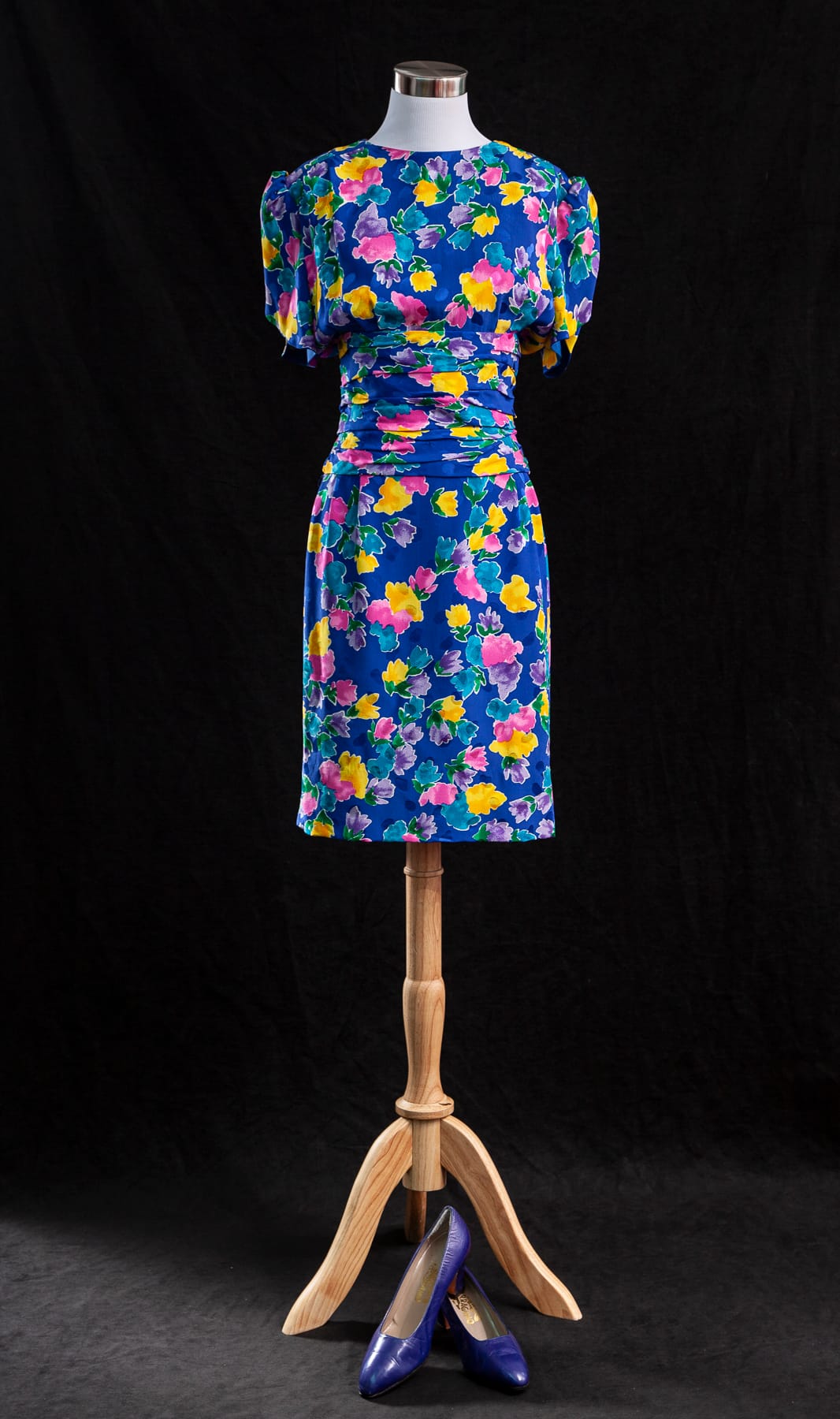 Image Credit: The Princess Diana Museum -- The “Caring Dress,” named by designer David Sassoon for Princess Diana’s frequent hospital and children’s visits wearing the piece. Its bright, cheerful colors made it a favorite among the children she met.