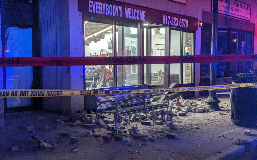 Bricks on Poplar Street sidewalk after falling from second floor of building