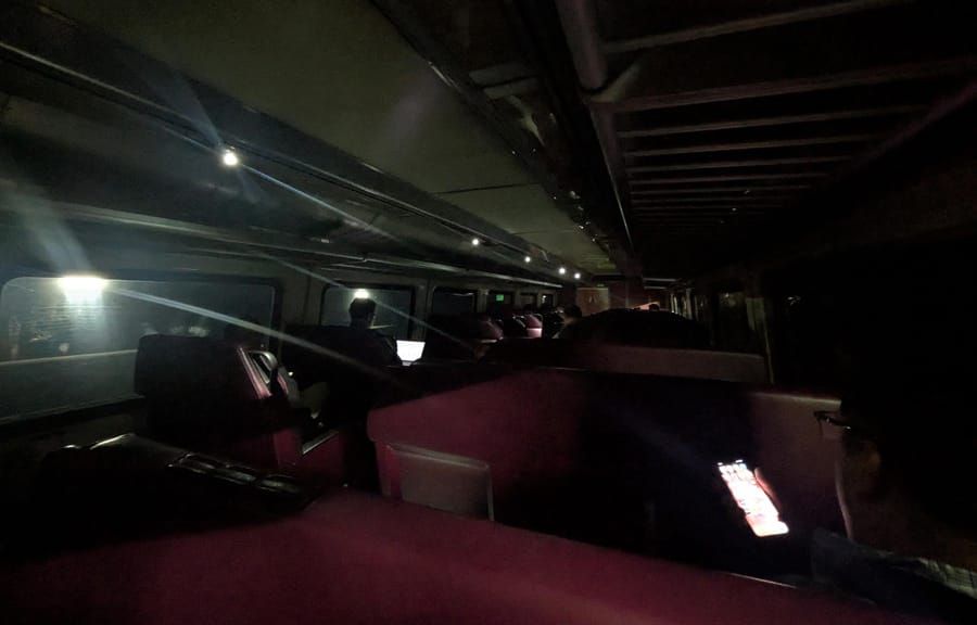 Some Needham Line riders had reason to be dour: They were stuck in a tunnel without any power