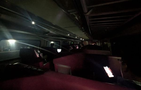 Some Needham Line riders had reason to be dour: They were stuck in a tunnel without any power