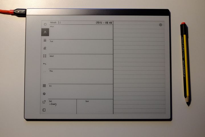 Picture of reMarkable 2 with a custom weekly journal template