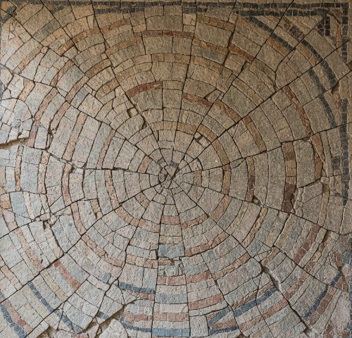 Cracked stone mosaic with tiles slightly misaligned