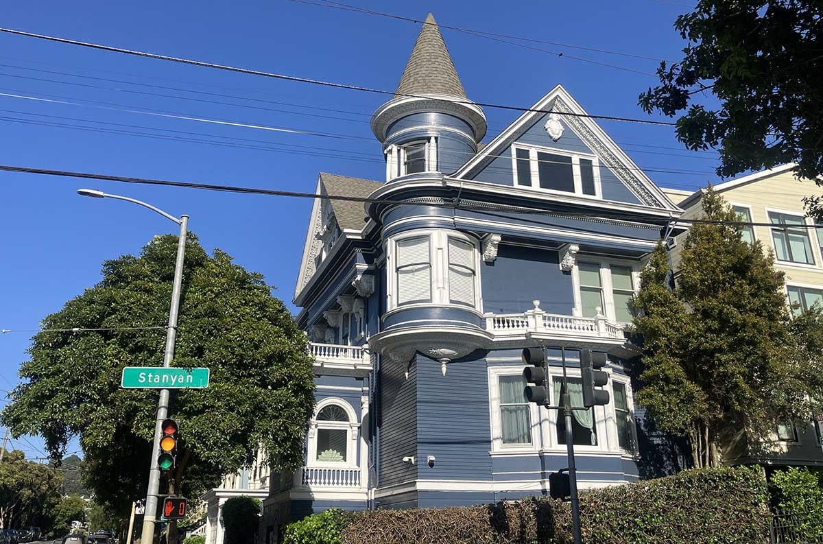 199 Cole Street, a multi-story blue home with a pointed turret.