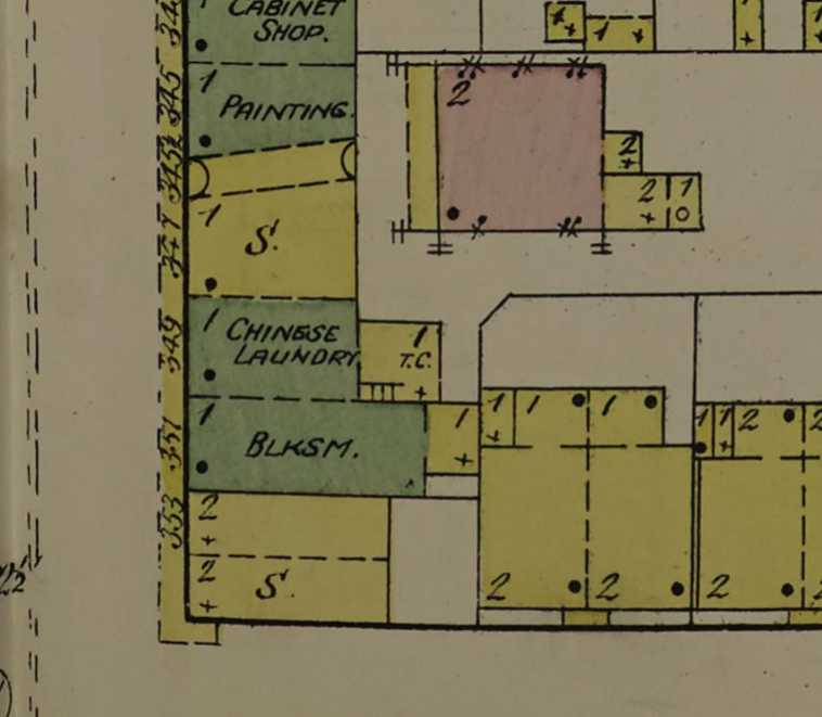 Detail of a Sanborn Fire Insurance Map showing building outlines with properties in green identified as "BLKSM," CHINESE LAUNDRY, PAINTING, and CABINET SHOP.