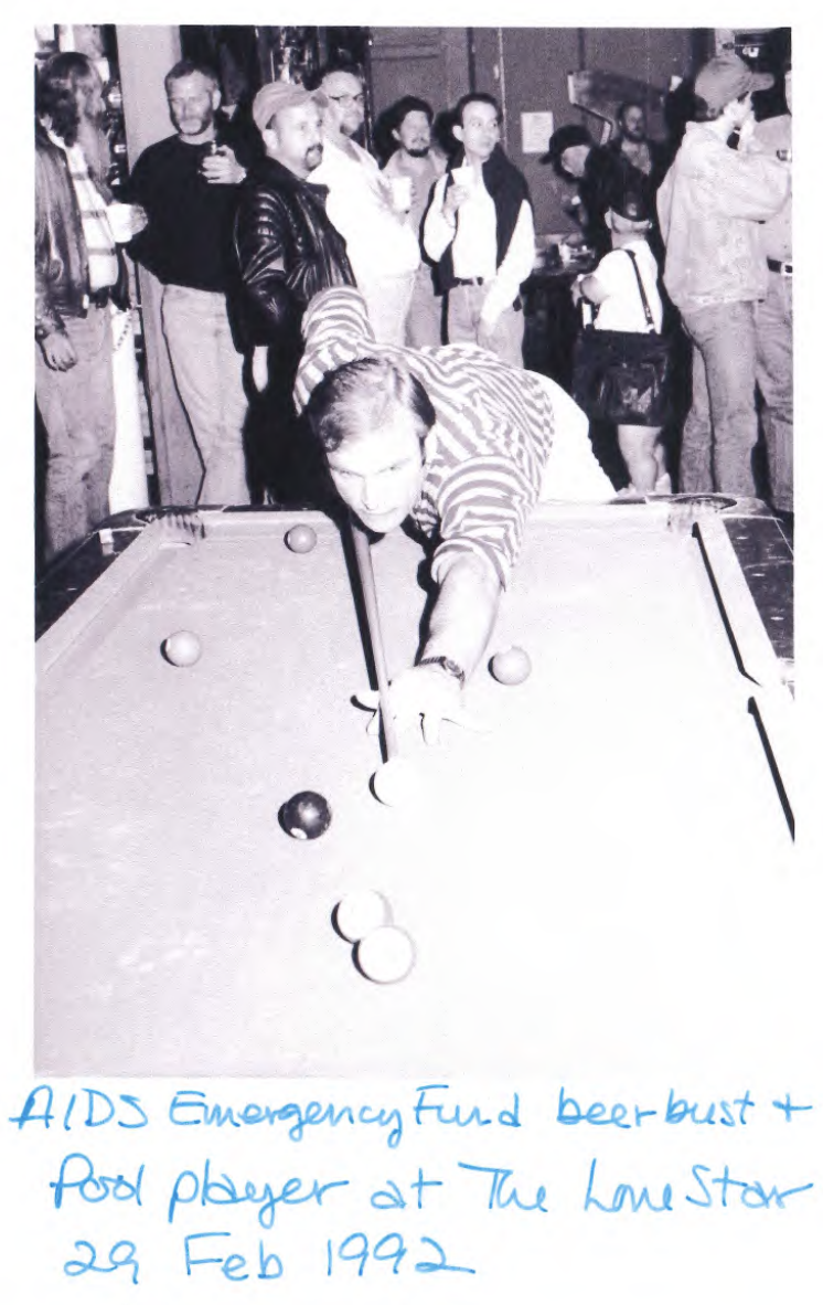 Black and white photo of man shooting pool inside of a bar, with handwritten caption AIDS Emergency Fund beer bust + pool player at The Lone Star 29 Feb 1992