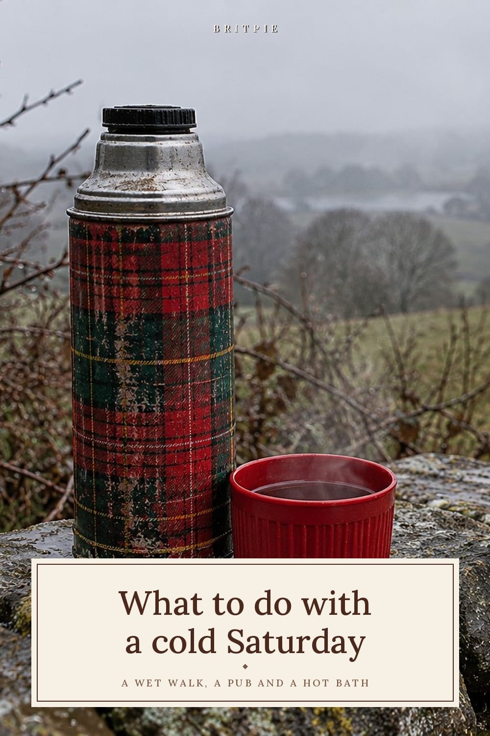 What to do with a cold Saturday in Britain, from the wet car park to the hot bath at the end: a battered tartan flask and a steaming cup of tea on a drystone wall above misty winter fields.