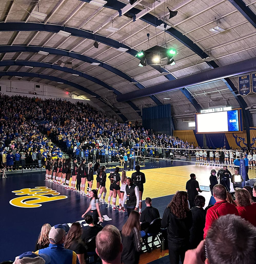 Photo shows a darkened Fitzgerald Field House and the entire sold out crowd standing before introductions