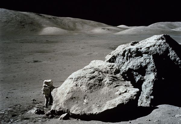 Photo of Apollo 17 geologist and astronaut Harrison Schmitt next to a large boulder at the Taurus-Littrow landing site. Source: NASA