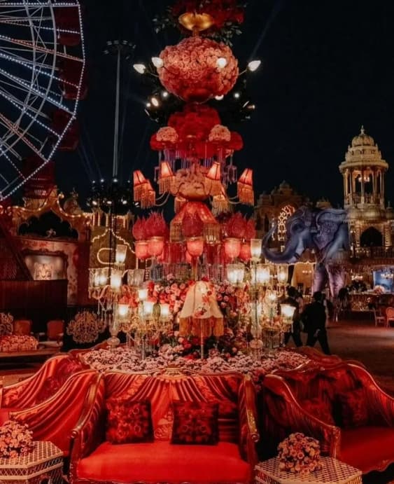 An outdoor flower and lighting arrangement comprising exotic flowers and lamp shades