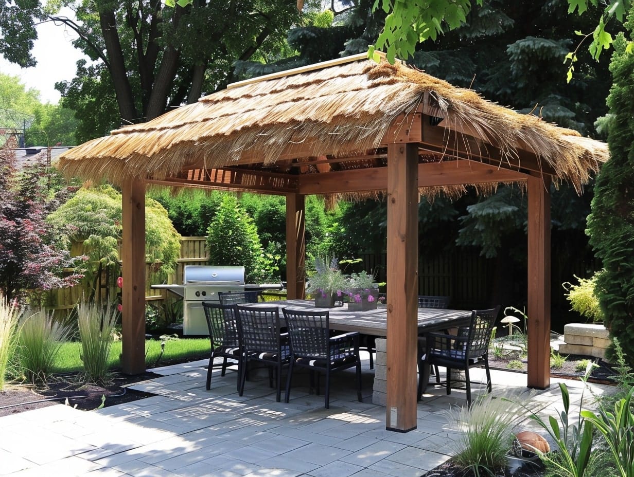 patio with a pergola with a thatched roof