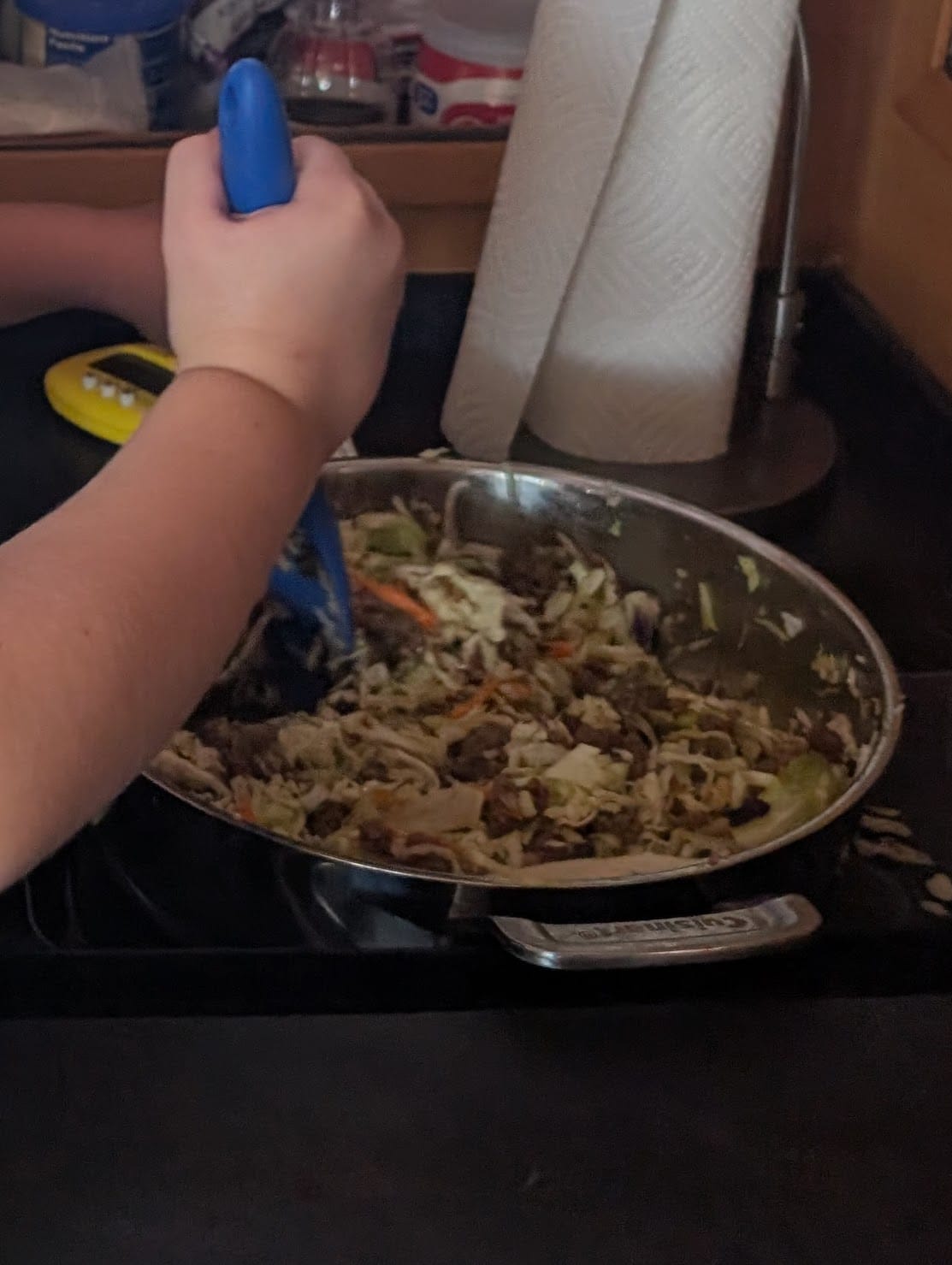 Cuisinart SmartNest stainless sauté pan being used for dinner in the boat galley