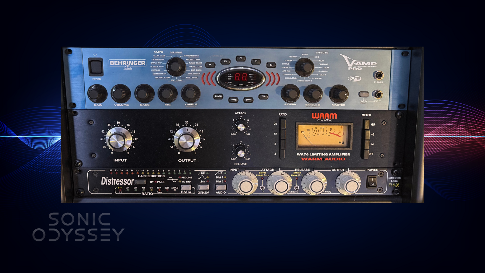 Recording studio rack with Empirical Labs Distressor, Warm Audio WA76 compressor, and Behringer V-Amp Pro modeling preamp.