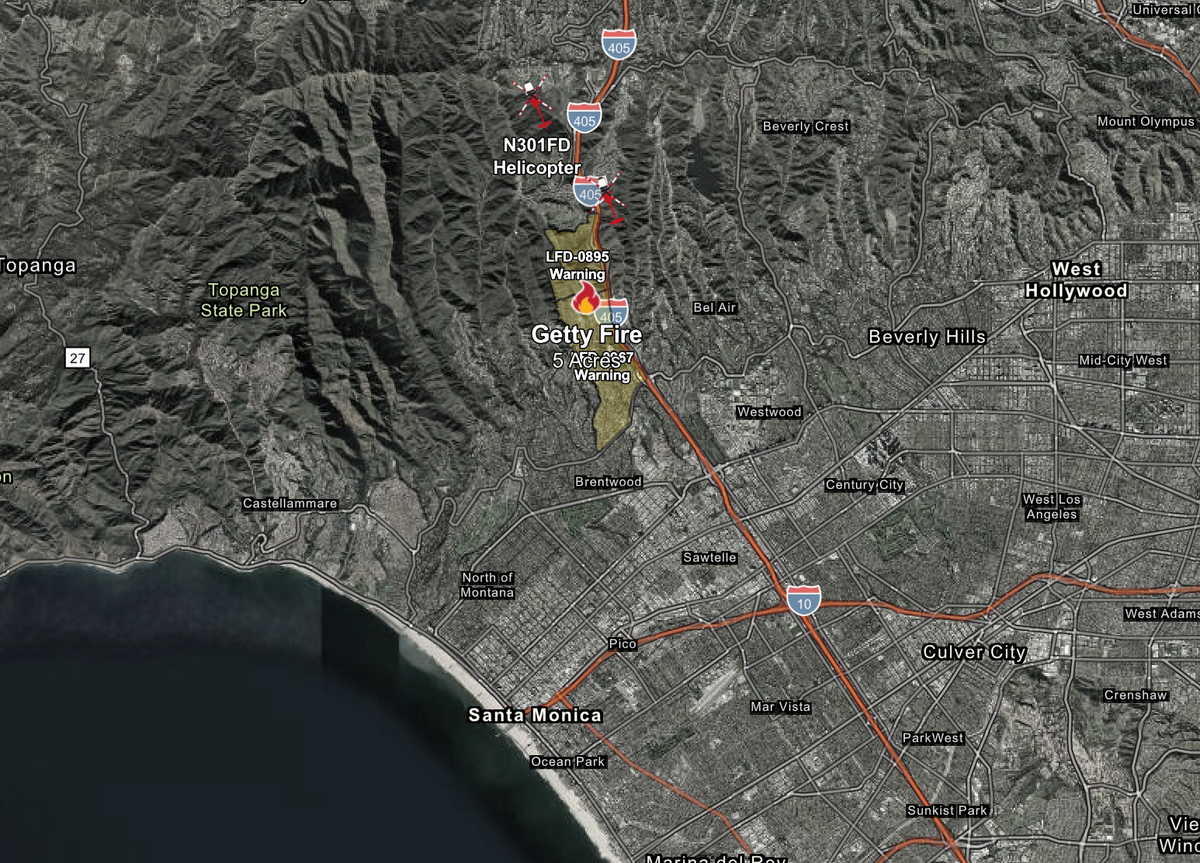 Evacuation warnings issued as brush fire burns near Getty Center