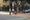 Santa Monica street scene with school zone warning sign and students walking near crosswalk during school dismissal time