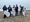 Volunteers participate in California Coastal Cleanup Day along a California coast, removing trash and debris to protect marine wildlife and beaches