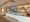 Interior of Bacio di Latte gelato shop on Montana Avenue in Santa Monica, designed to resemble an Italian country kitchen with hand-glazed tile and exposed wood beams.