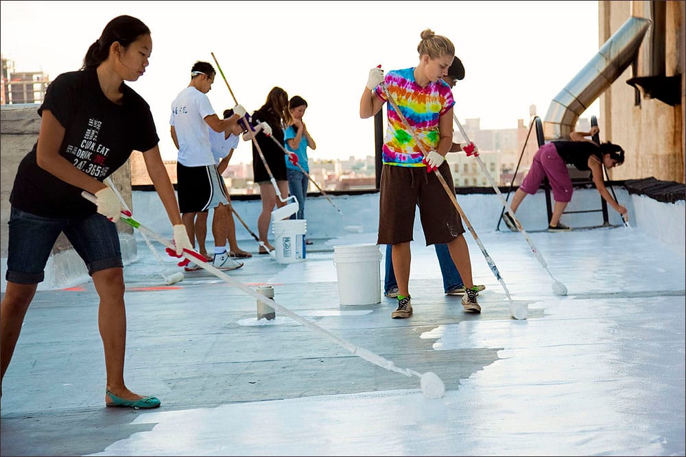 AT WORK: Some 90 percent of U.S. buildings have dark-colored roofs which, when exposed to full sun can increase in temperature by as much as 90 ¬∞F. A white roof typically increases temperatures only 10-25 ¬∞F above ambient air temperatures during the day. (Photo courtesy White Roof Project)