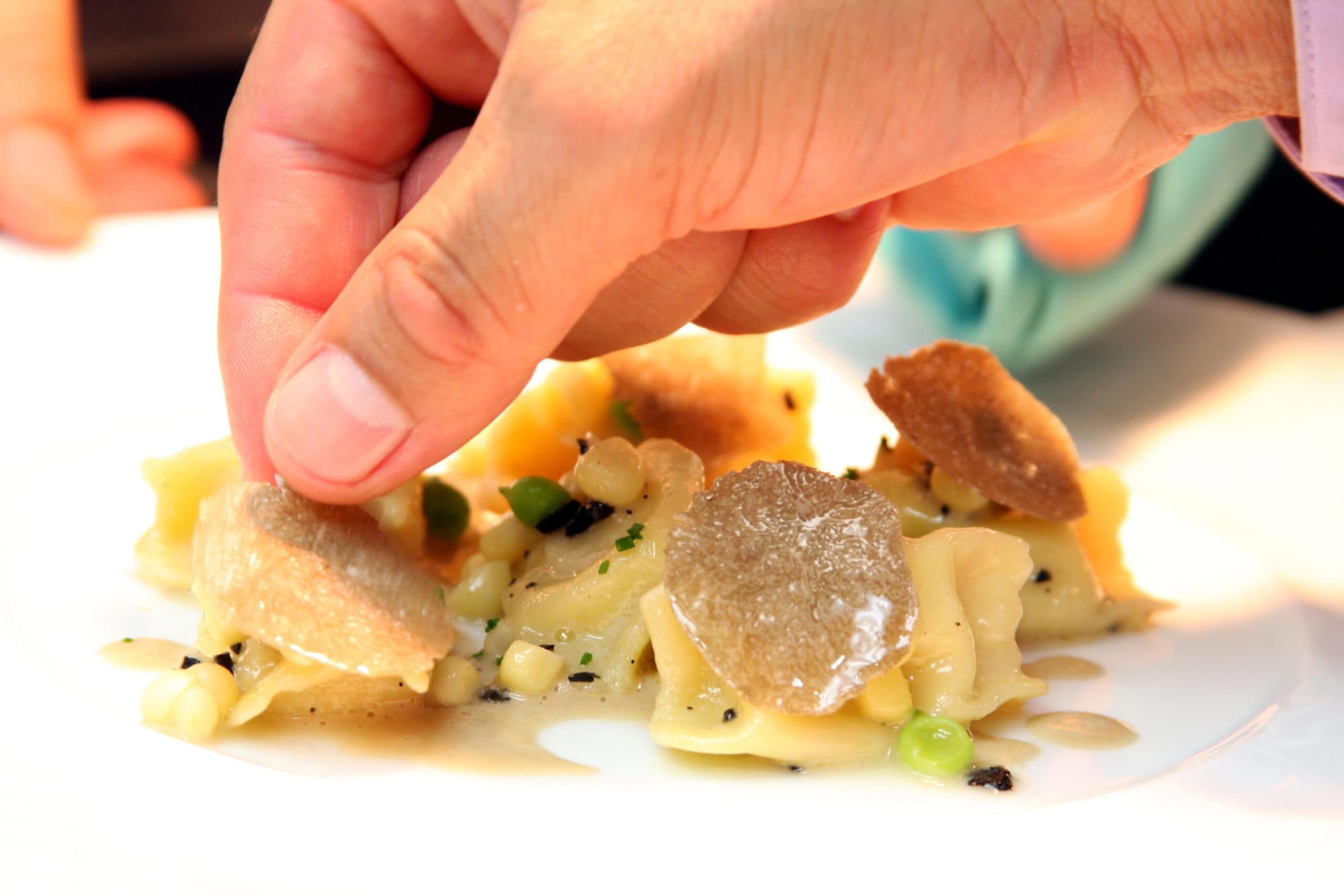 Those seeking fine dining and delicately constructed entrees in Santa Monica might look to Melisse during dineLA's Restaurant Week. Here a chef puts finishing touches on sweet white corn ravioli in a summer truffle sauce. (File photo)