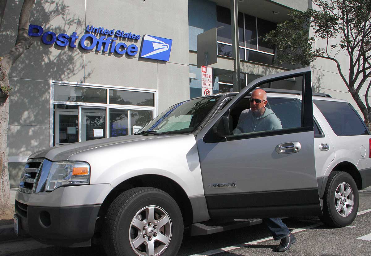 A postal customer boards his truck after dropping off items at the post office on Seventh Street on Monday. (Daniel Archuleta daniela@www.smdp.com)