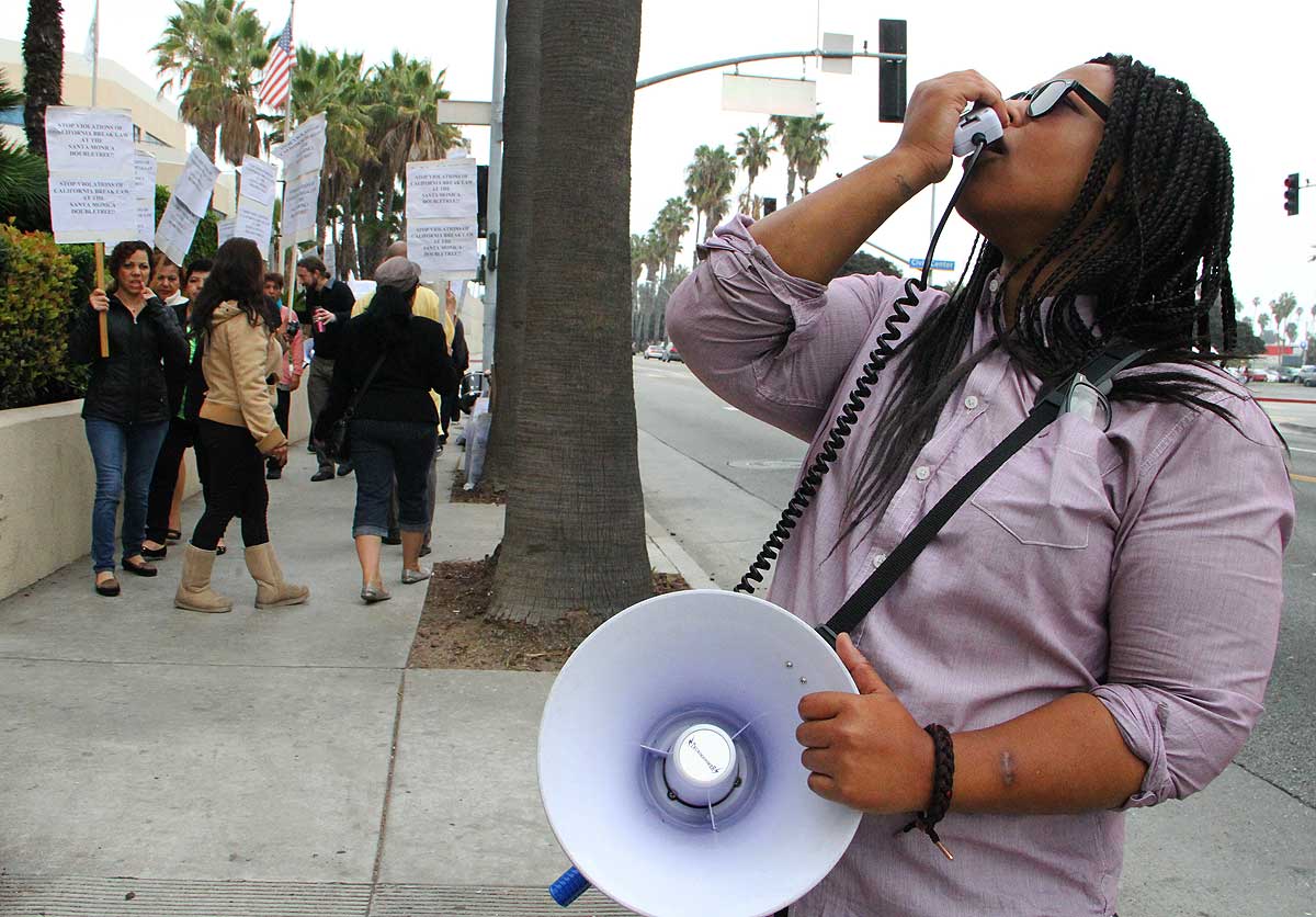 STOKING THE CROWD: Local hotel workers and union organizers staged a protest outside of the DoubleTree Suites on Tuesday afternoon claiming that hotel management didn't provide them with adequate break times. (Daniel Archuleta daniela@www.smdp.com)