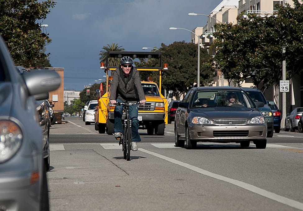 A man rides his bike on Broadway. (File photo)