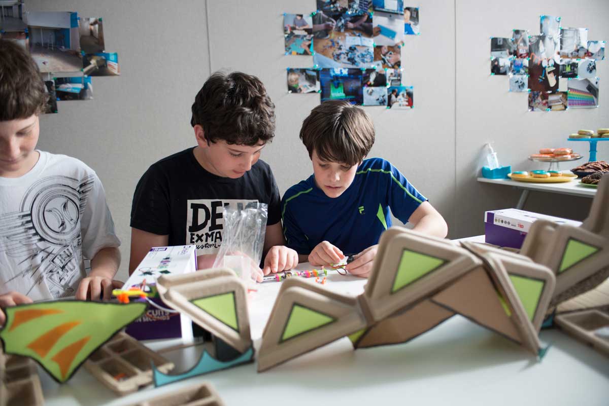 Kids at an open house for Digital Dragon, which provides after-school programs with a tech focus, are hard at work building a circuit board. Digital Dragon's creators, Santa Monica parents Laurie Kantor Finn and her husband, Seth Finn, saw a need for after-school programs that cater to young geeks.  (Photo courtesy Digital Dragon)