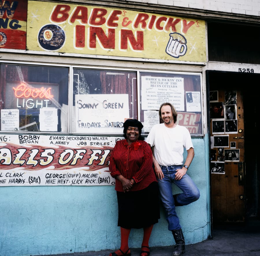 Mama Laura outside the original Babe's & Ricky's Inn on Central Avenue with Jonathan Hodges.