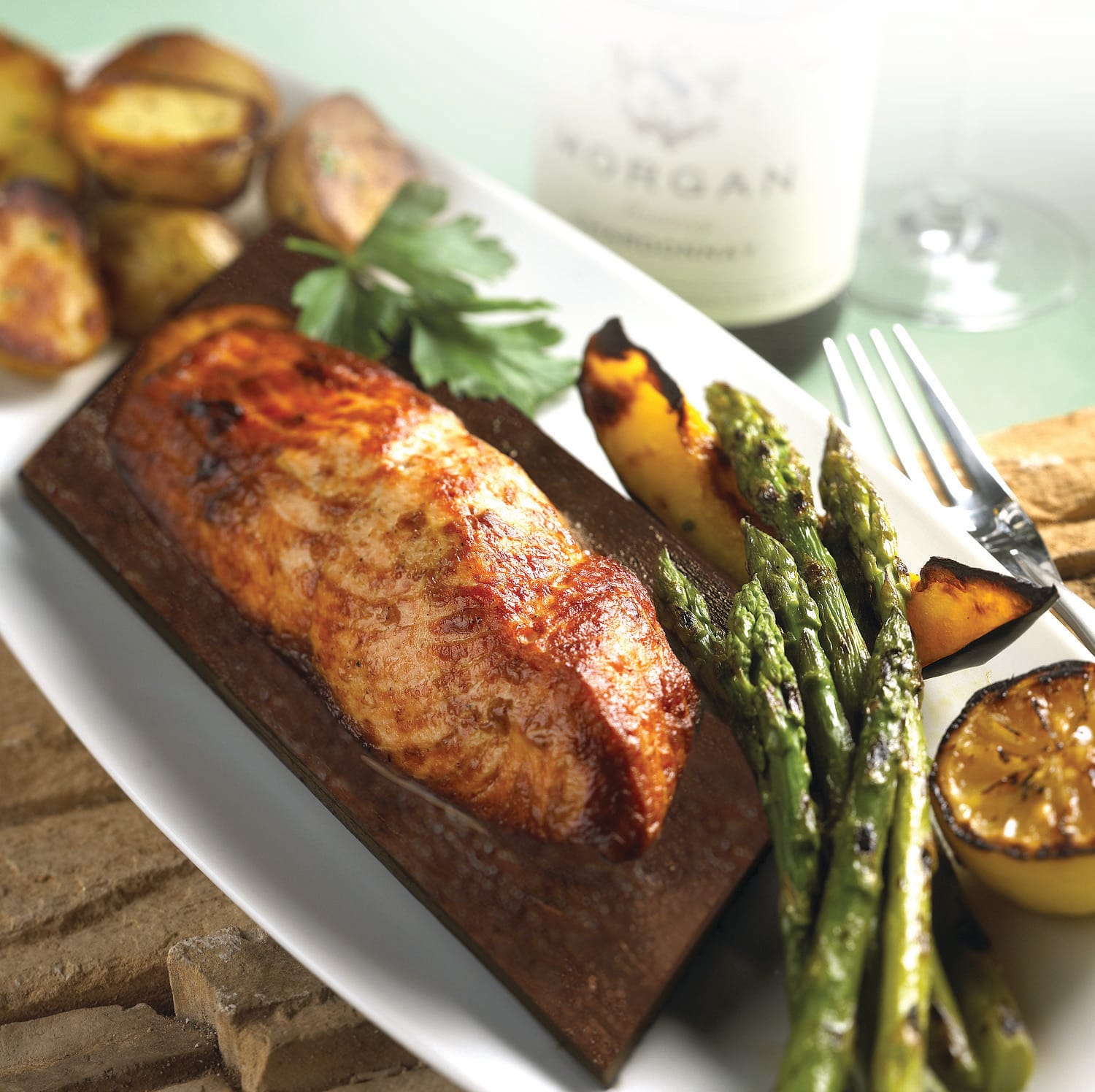 Seasons 52 chegs use ceder planks to help enhance the flavor of salmon without adding any additional calories to the dish. (Photo courtesy Seasons 52)