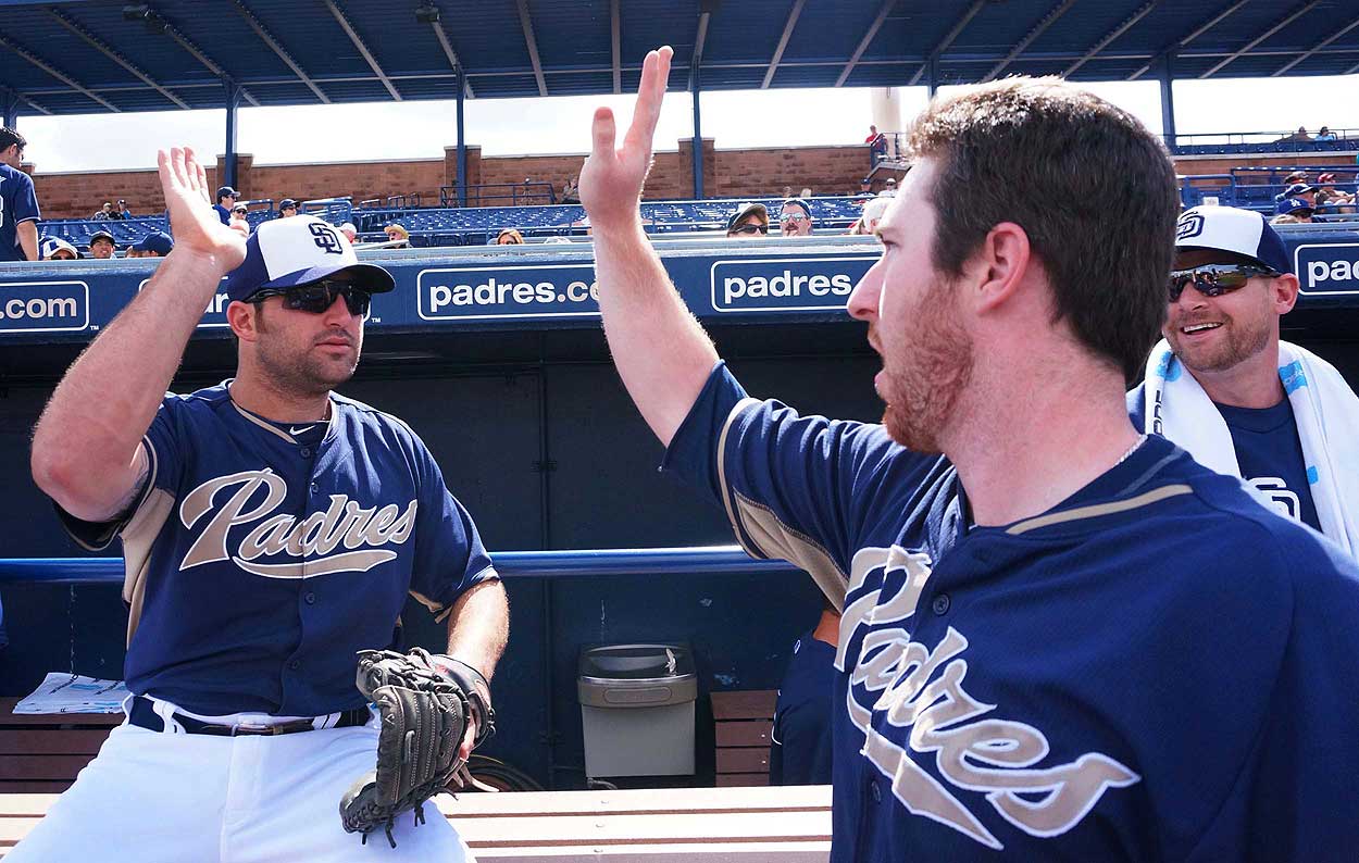 Cody Decker (left) gives a teammate a high five during spring training.                           (Photo courtesy San Diego Padres)