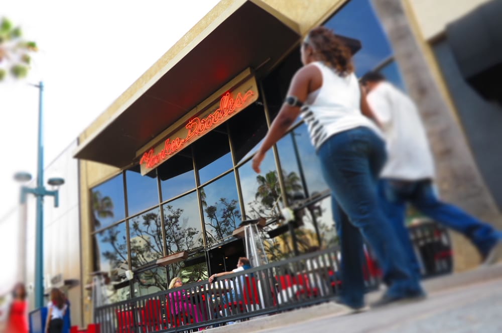 Shoppers walk past Yankee Doodle's on Friday afternoon. (Photo by Brandon Wise)