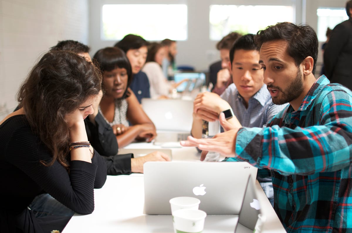 Student Sherif Matar (right) goes over his final project he did for the cookie company 'Modern Bite.' (Paul Alvarez Jr., editor@www.smdp.com)