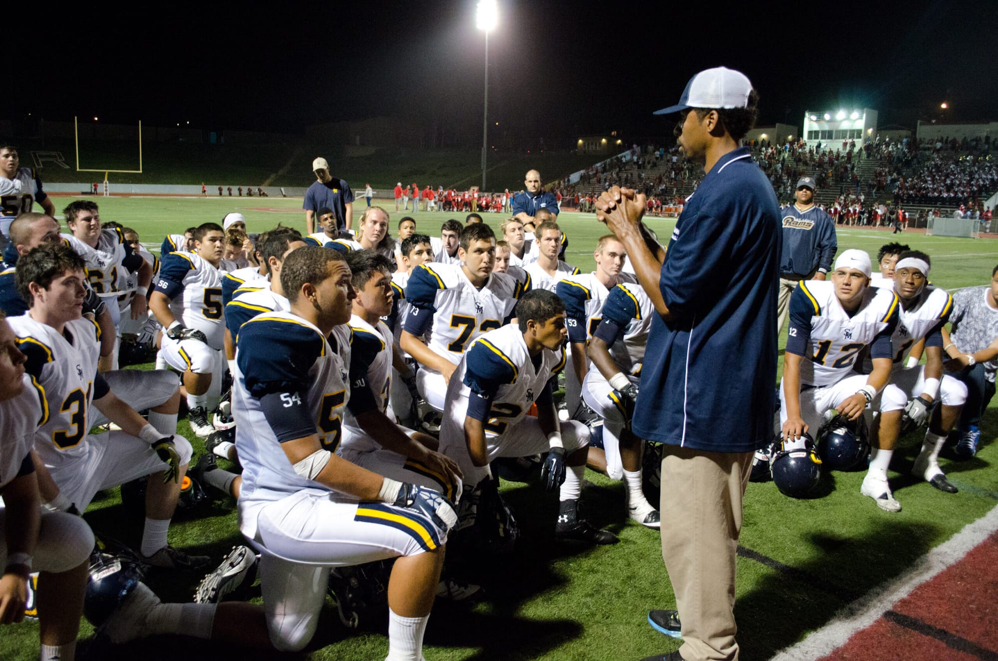 Head coach Travis Clark talks to his team after winning 17-14 against Redondo Union High School at the Sea Hawk bowl last Friday night. (Photo by Paul Alvarez, Jr.)