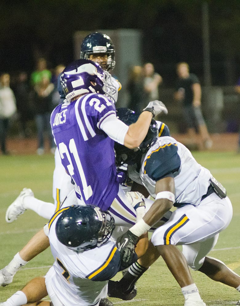 TAKE DOWN: The Santa Monica defense swarms Valencia's Nick Jones Friday night at Valencia. Samohi would go on to lose, 42-21. (Paul Alvarez Jr. editor@www.smdp.com)