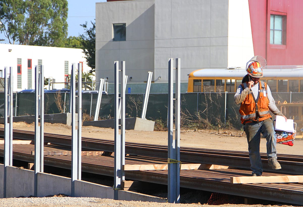 A worker leaves the construction site of the Expo Light Rail Line at the corner of 17th Street and Colorado Avenue on Tuesday. (Daniel Archuleta daniela@www.smdp.com)