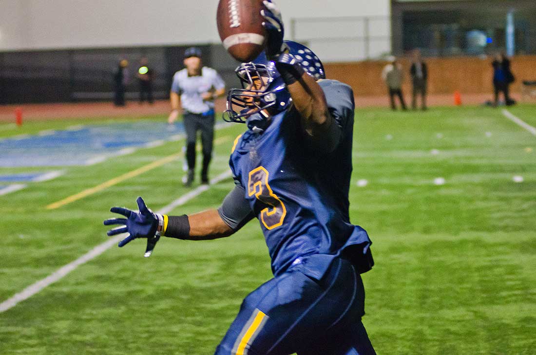 PAY DIRT: Samohi's Will Taylor celebrates as he runs toward the endzone for his second touchdown of the night at Santa Monica College's Corsair Field Friday night in a 27-0 victory over Channel Island during the first round of the playoffs. Next for Samohi is a road game at Lompoc. (Paul Alvarez Jr. editor@www.smdp.com)