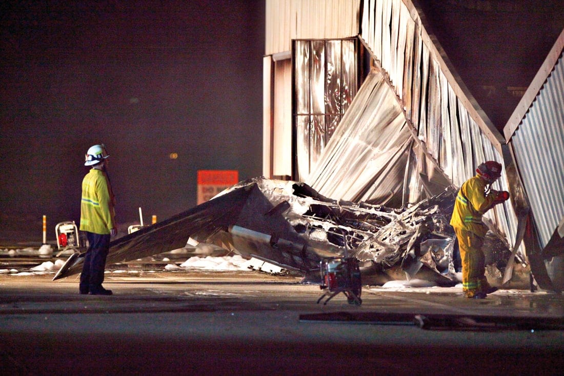 Firefighters survey the crash site at Santa Monica Airport in September. (Photo courtesy David J. Hawkins)