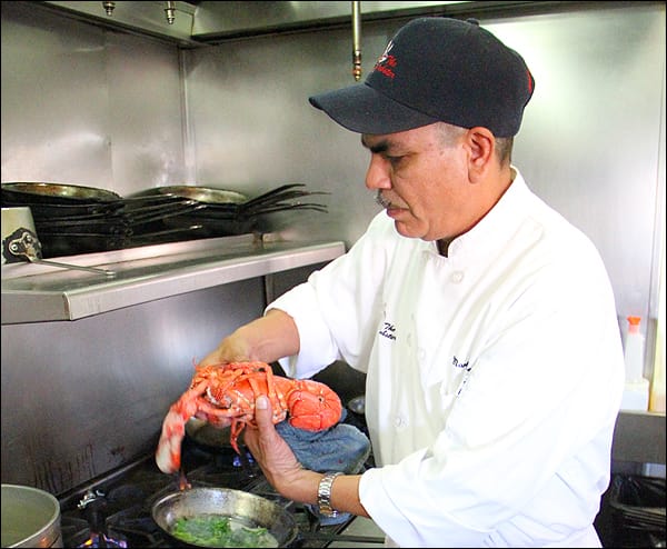 Sous chef Martin Cervantes prepares lobster at The Lobster on Tuesday.